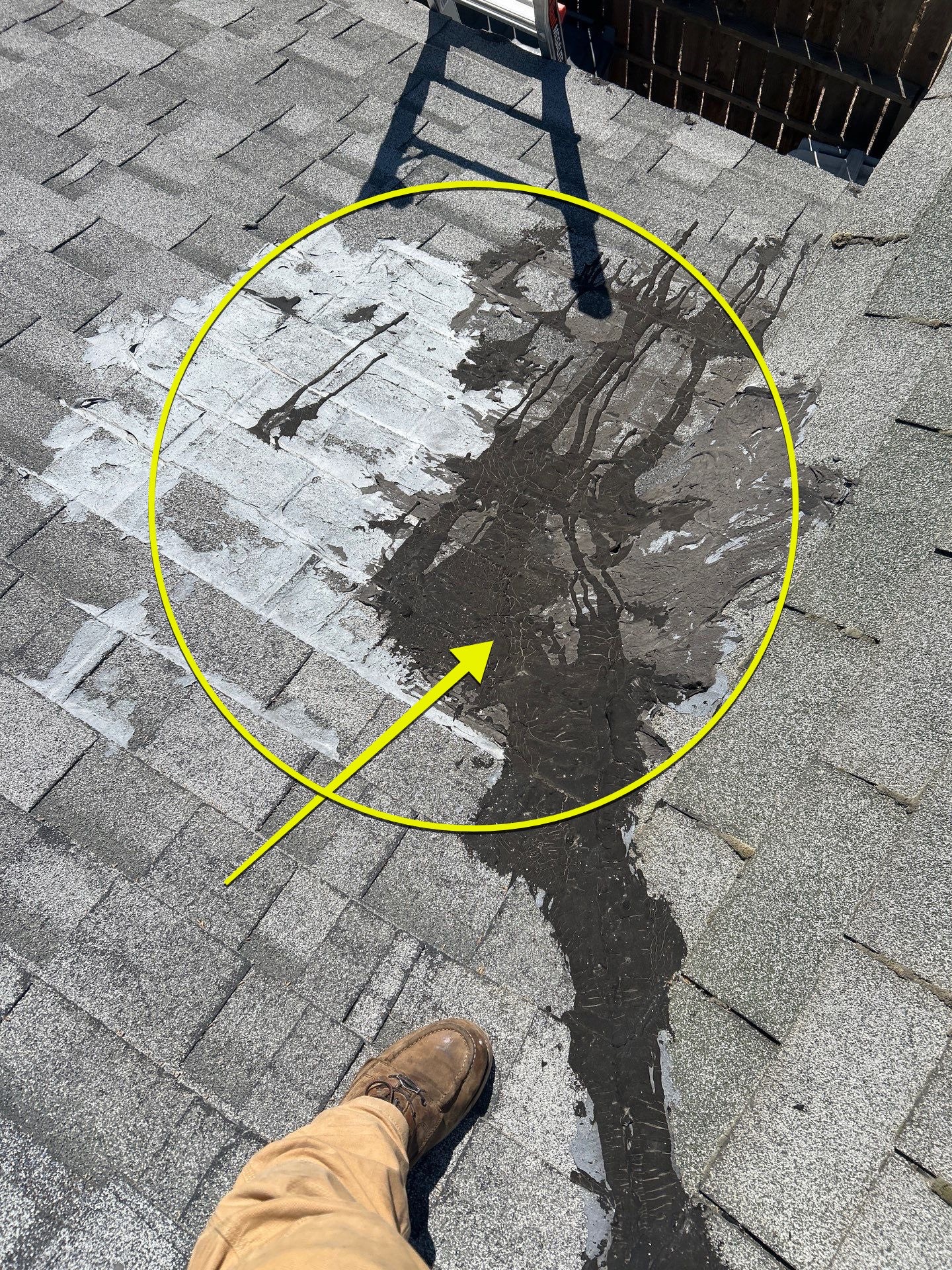 Spot repair sealed on an asphalt shingle roof during a pre-winter inspection