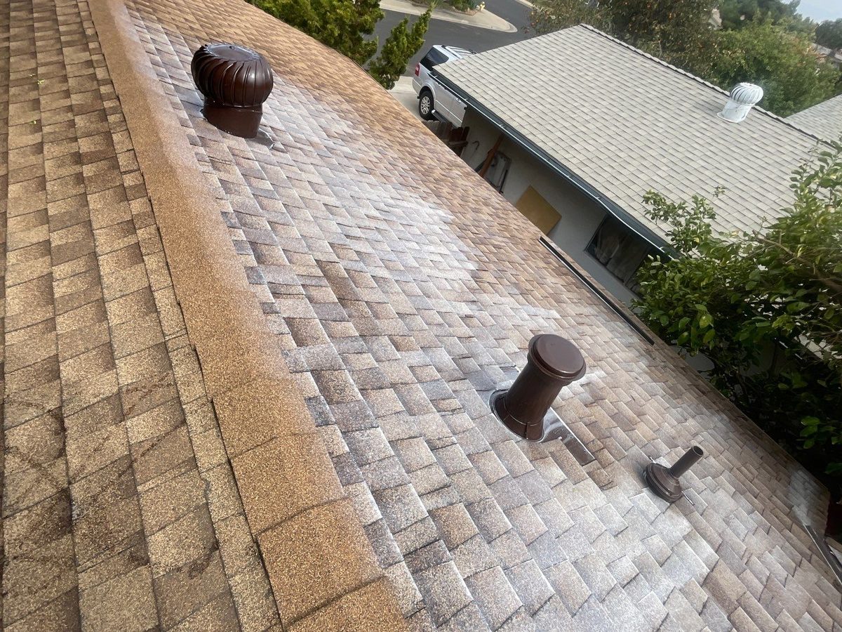 A Clovis asphalt shingle roof right after a Roof Maxx treatment, with new ridge caps along the hip and sealed vent pipes